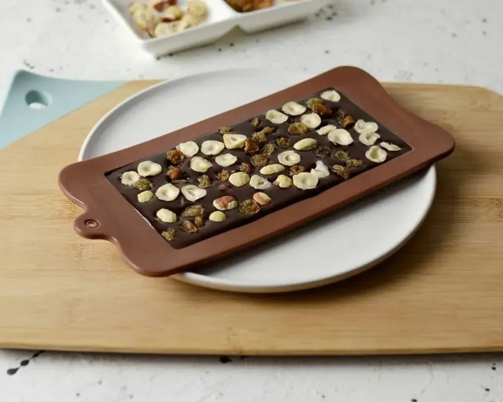 tahini chocolate bar with nut topping