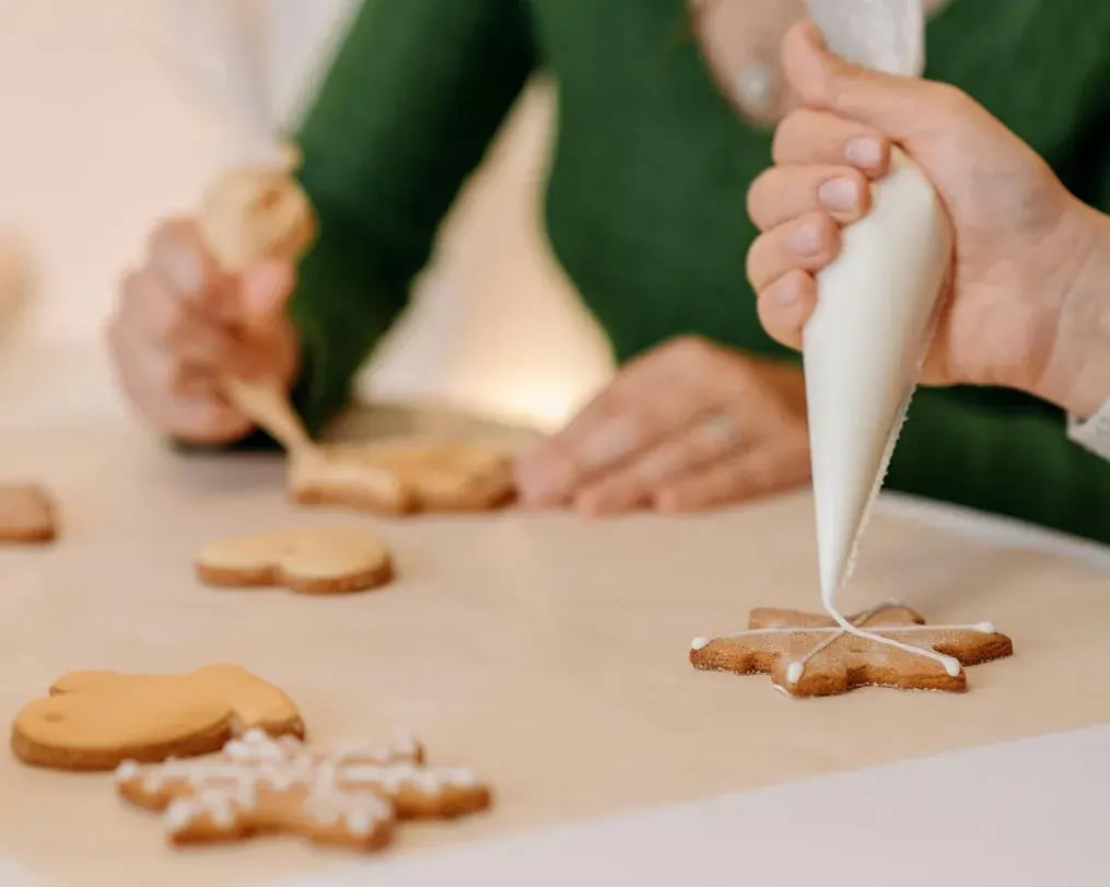 Different Shaped Chai Spiced Cookies Being Decorated