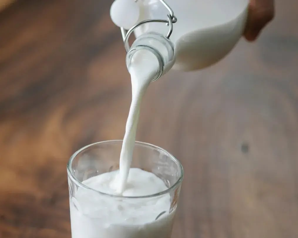 plant based milk poured into glass