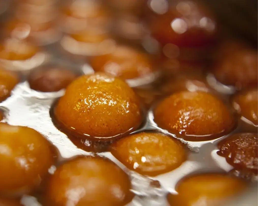 Deep Fried Gulab Jamuns In Sugar Syrup