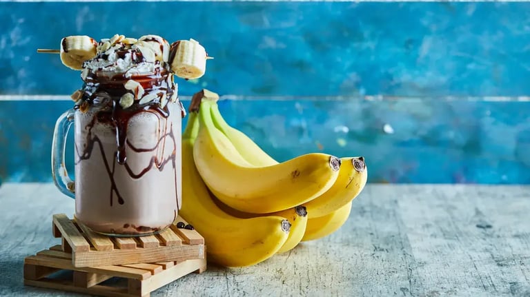 Caramel Banana Milkshake With Toasted Almond Topping