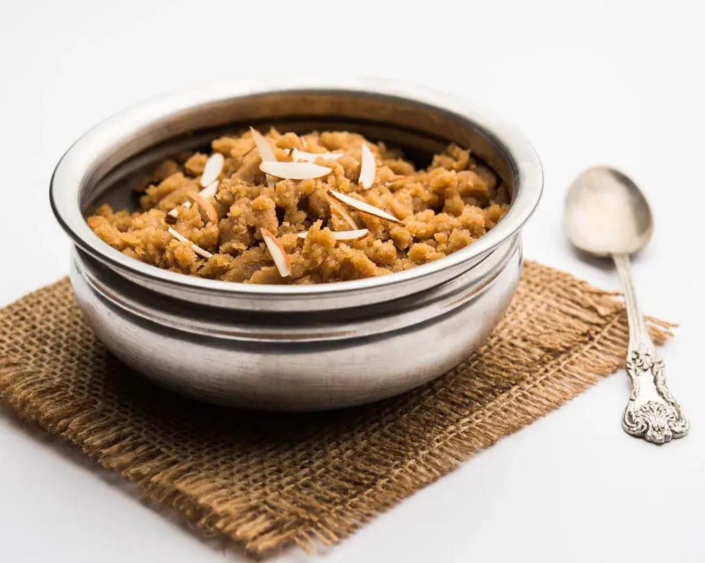 Cardamom Bournville Lapsi With Wheat And Dry Fruits In A Bowl