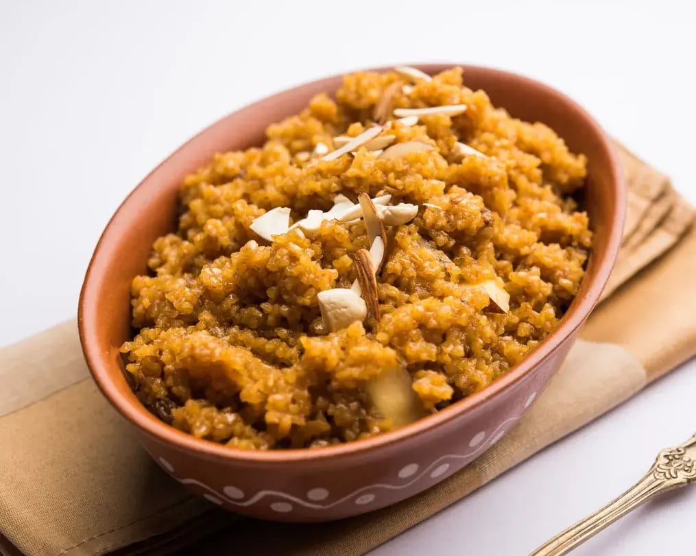 Cardamom Bournville Lapsi With Wheat And Dry Fruits In A Bowl