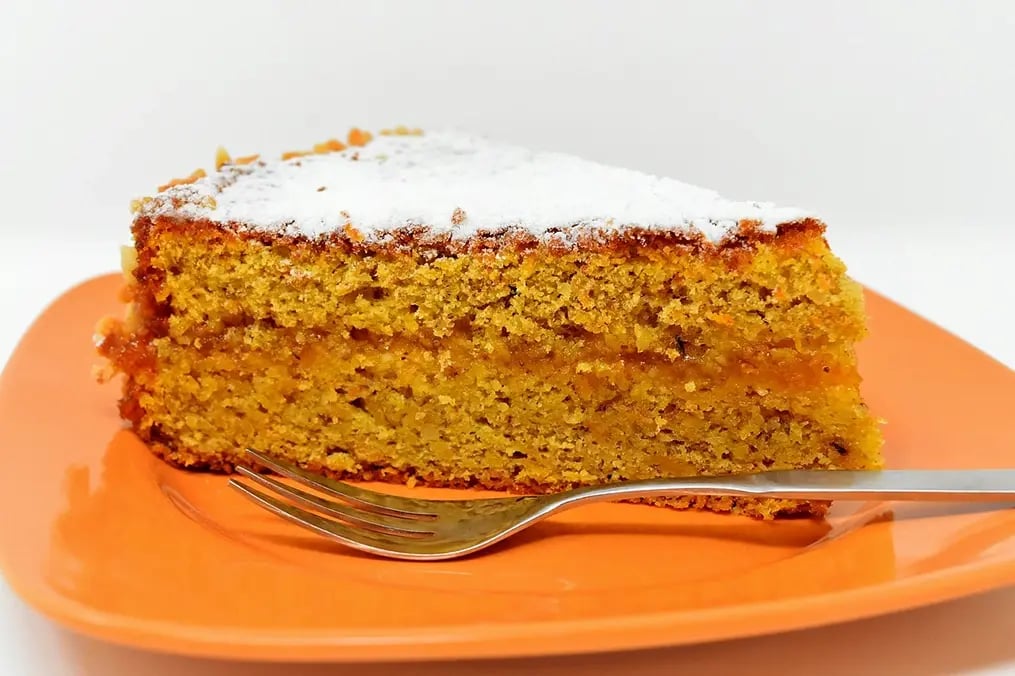 Celebrate Every Occasion with These Irresistible and Flavorful Bundt Cake Recipes - A Piece of Carrot Bundt Cake with Cream Cheese Glaze
