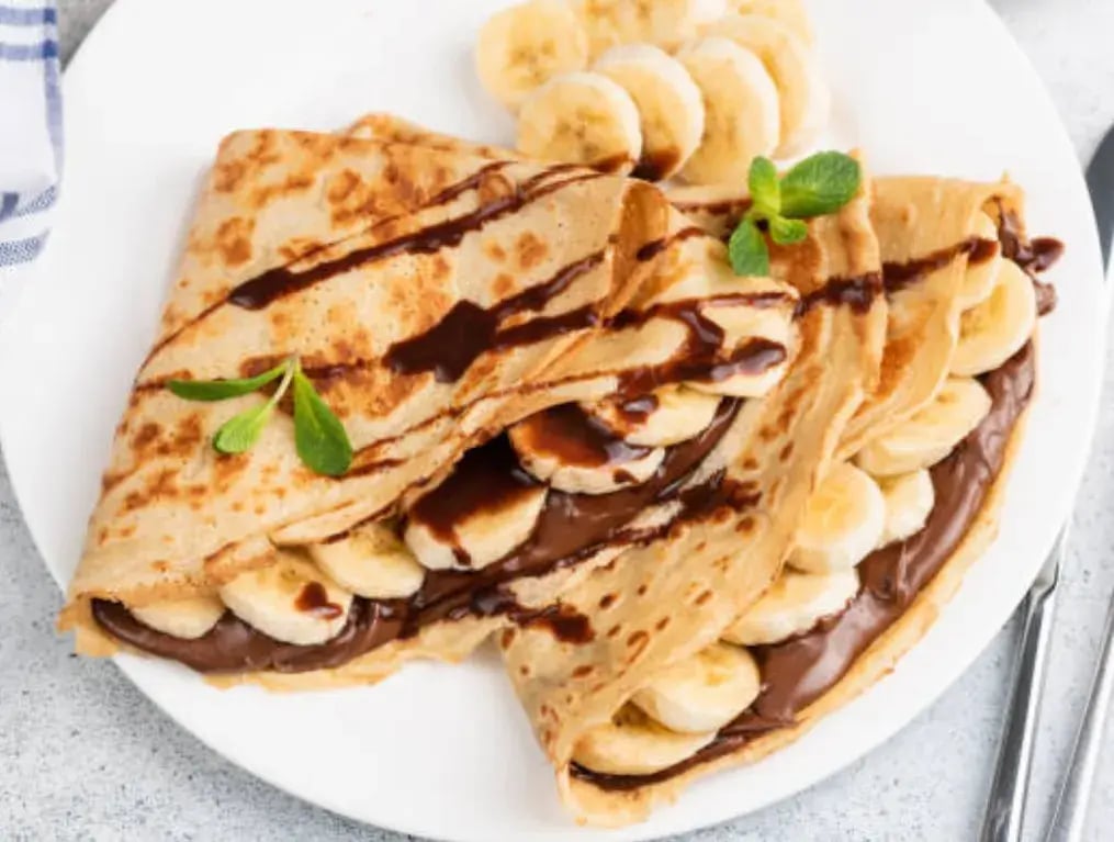 Crepe Boats With Milk Chocolate And Dry Fruits