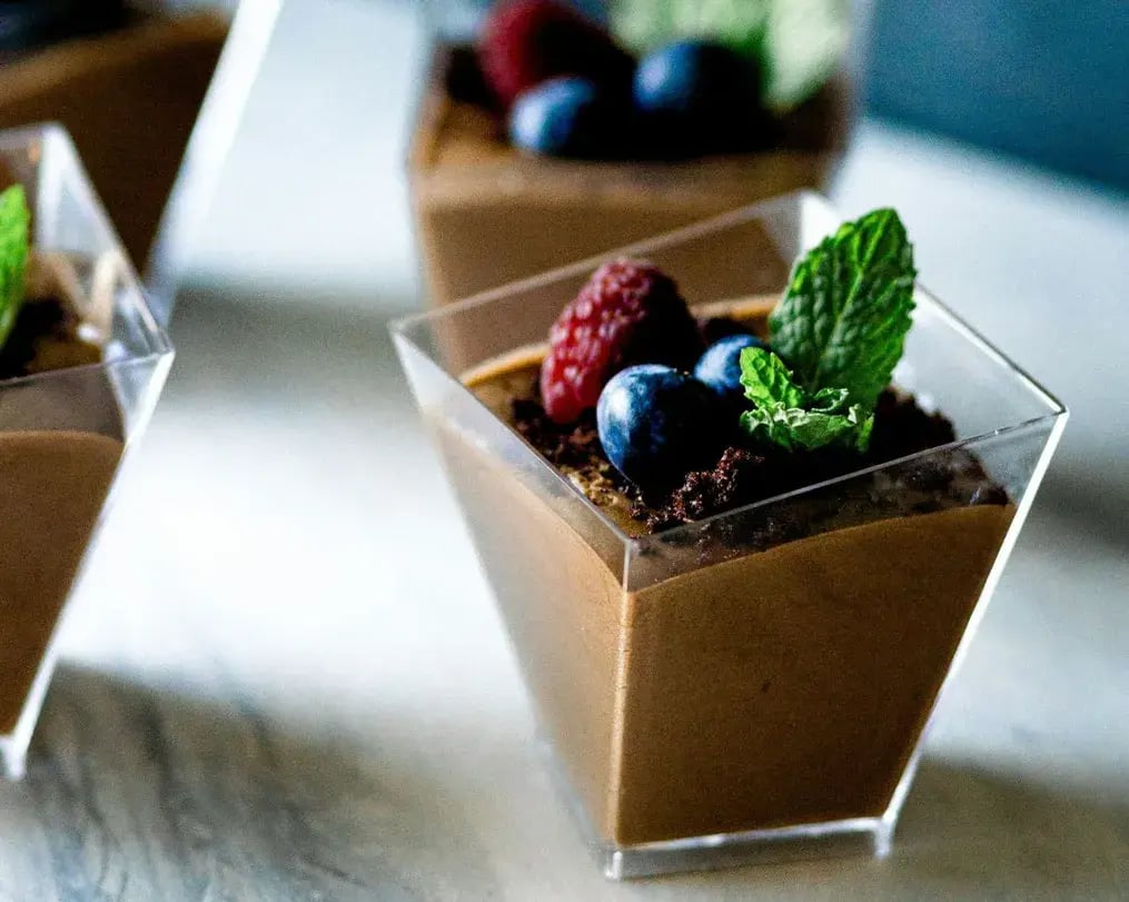 chocolate custard topped with chocolate mint and berries