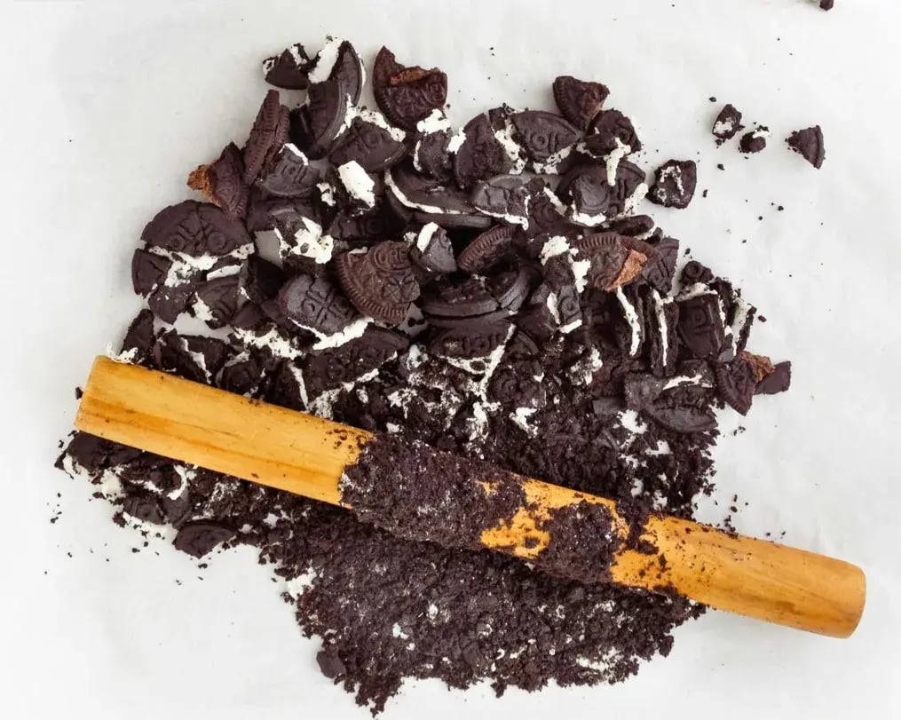 Rolling pin crushing Oreos