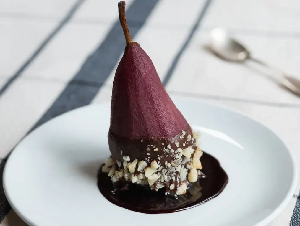 A Step-By-Step Guide To Make Chocolate-Poached Pears With Pistachio Crunch