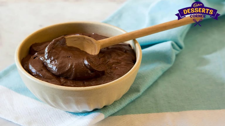Feature Image - Thick chocolate pudding served in a wooden bowl 