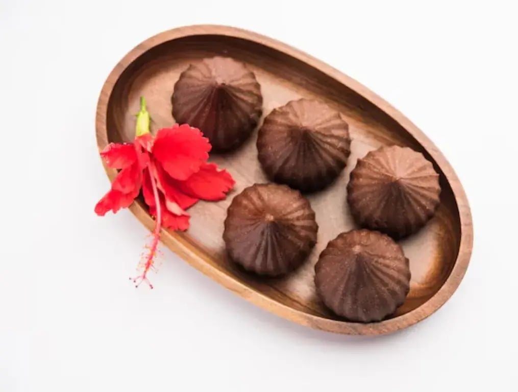 Coconut Jaggery Desserts With Bournville: A Perfect Blend Of Tradition And Luxury - Chocolate-Coated Coconut Modaks