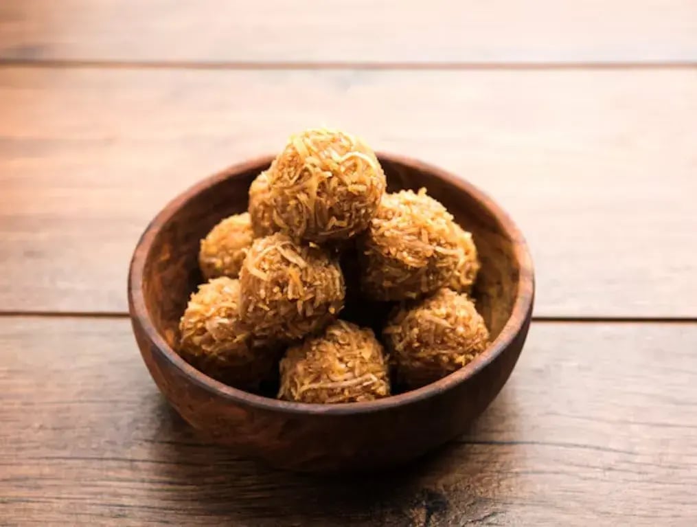Coconut Jaggery Desserts With Bournville: A Perfect Blend Of Tradition And Luxury - Coconut Jaggery Laddoo with Bournville Shavings
