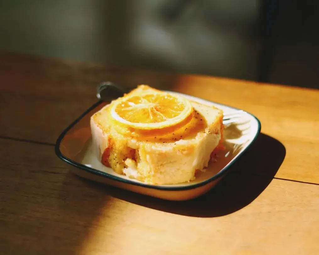 Slice of orange roll with orange slice