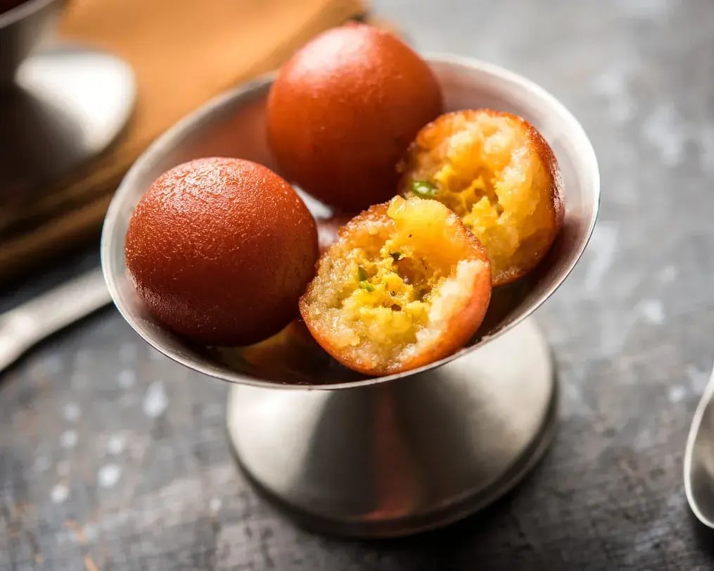gulab jamun served with nuts