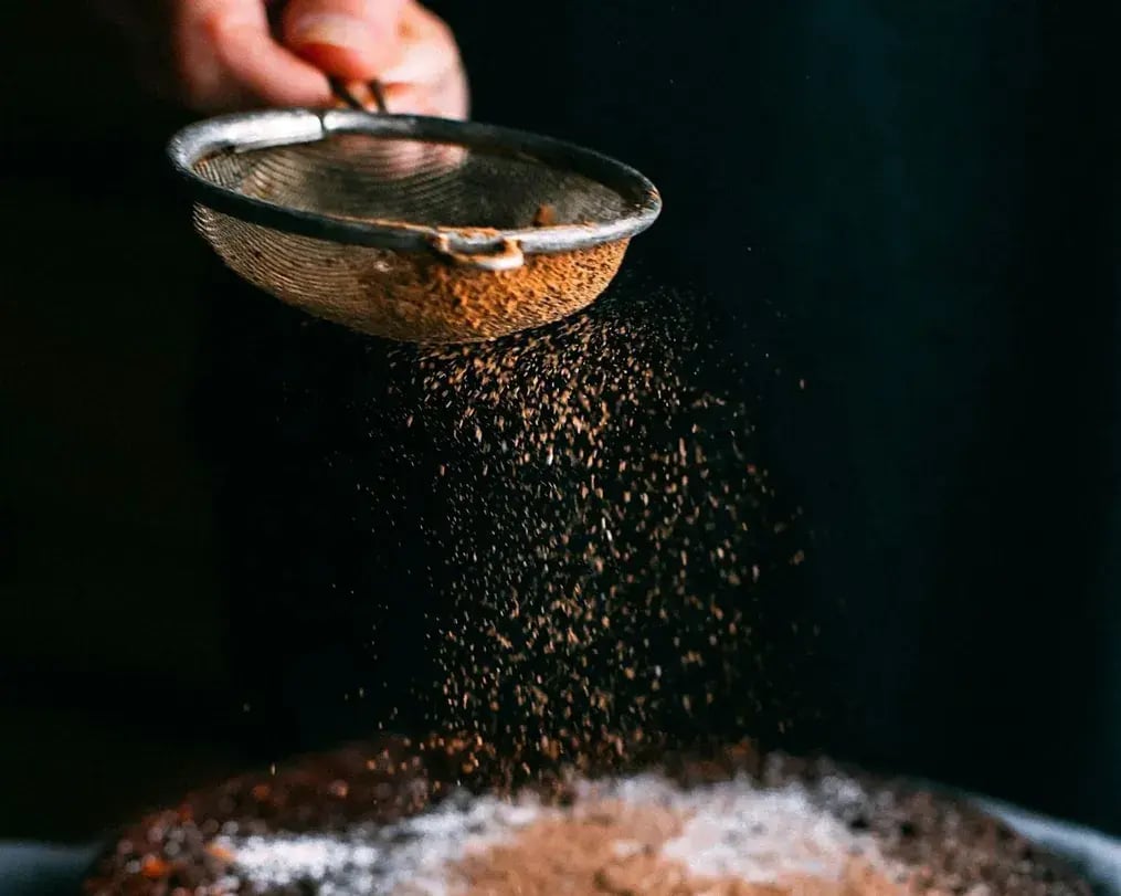 Sieve With Cocoa Powder Cocoa Powder Dusted On Dessert
