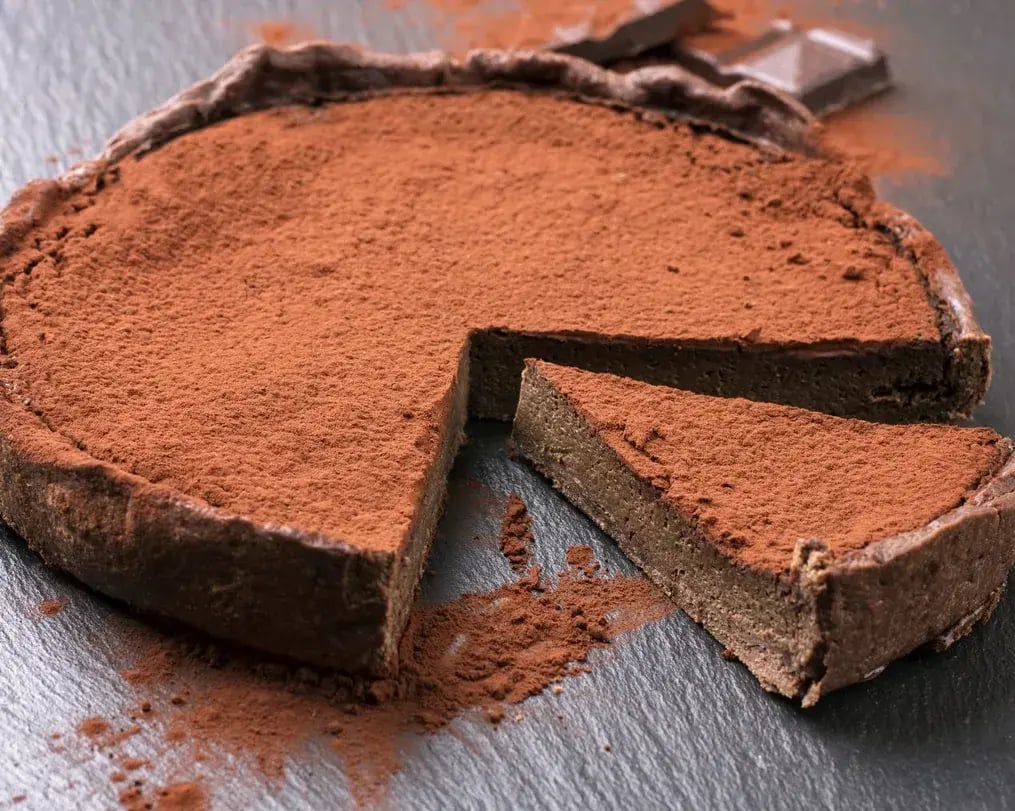 Dark Chocolate Tart Topped With Cocoa Powder