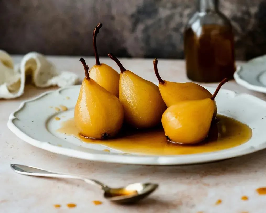 How to Make Elegant Merlot Poached Pears for Wine Day - Whole poached pears on a plate