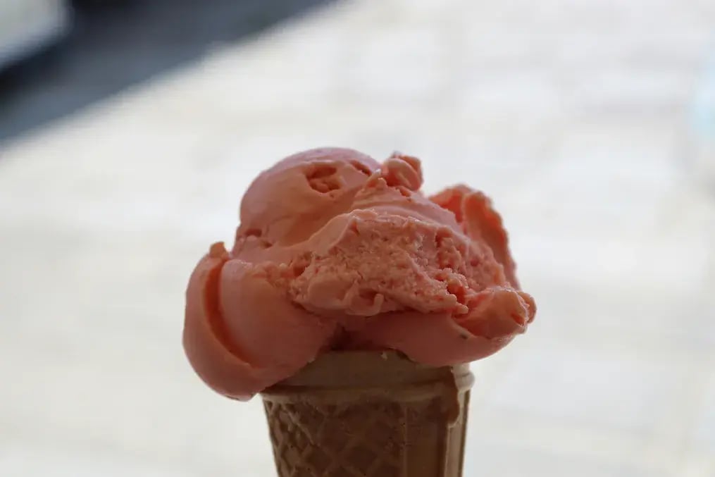 How to Make Fragrant Rosewater Gelato with Almond and Dairy Milk - A closeup of rosewater gelato with almond and dairy milk