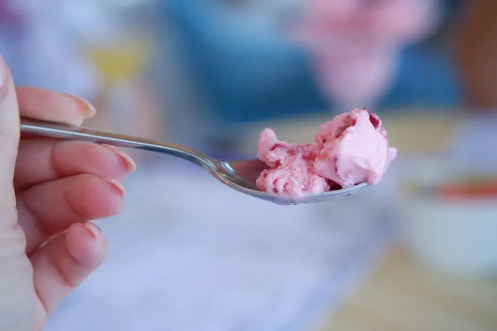 How to Make Fragrant Rosewater Gelato with Almond and Dairy Milk - A spoonful of rosewater gelato with almond and dairy milk