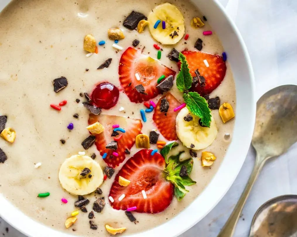 Fruit custard with fruits cashews and Oreos topped