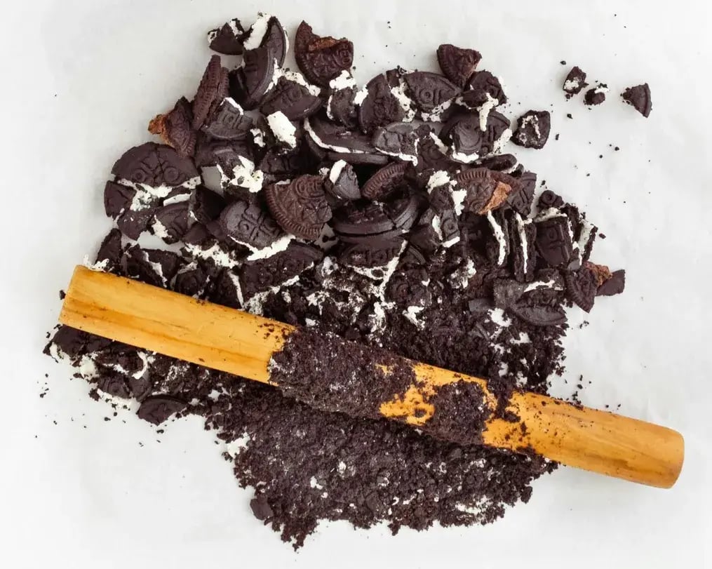 Oreo crumbs being made for cheesecake base