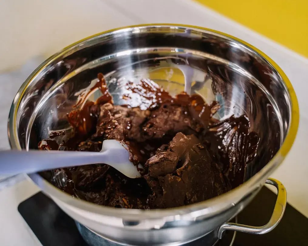 Carefully Melting the Cadbury Silk mango mousse with silk chocolate swirls