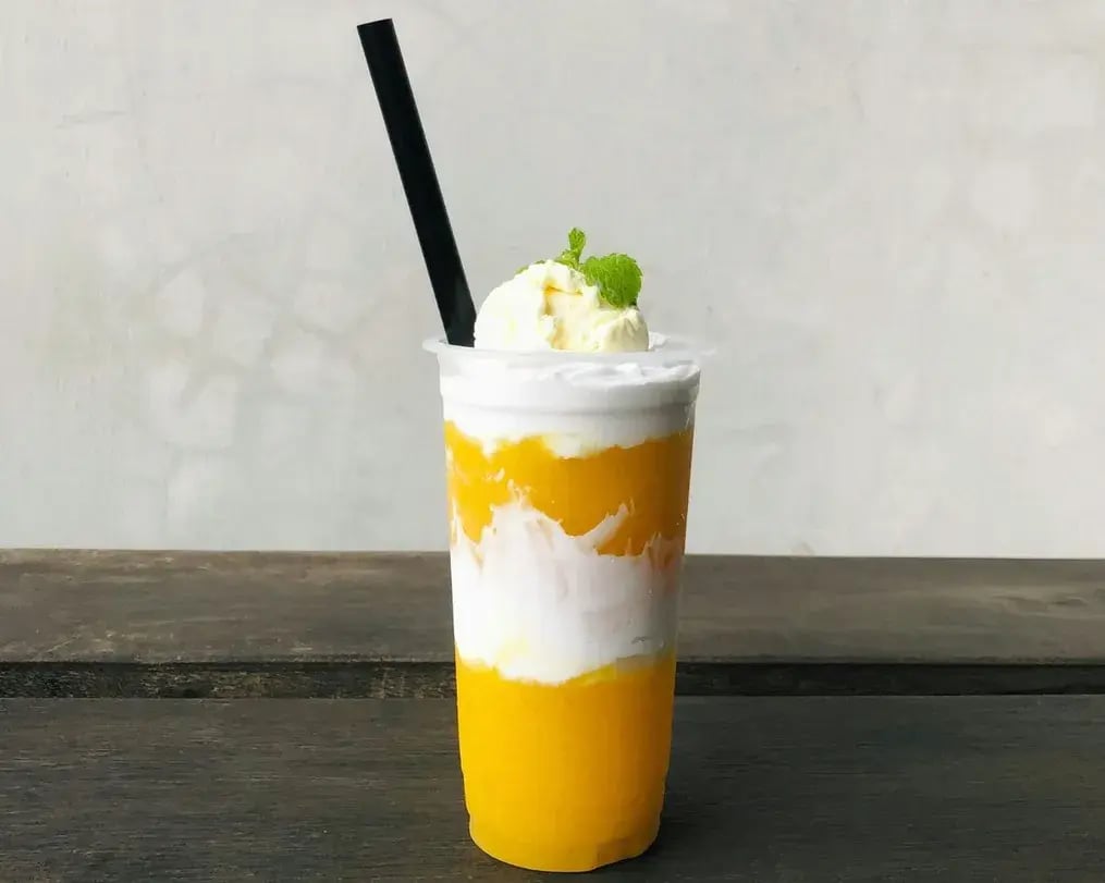 Layered mango mousse with silk chocolate swirls