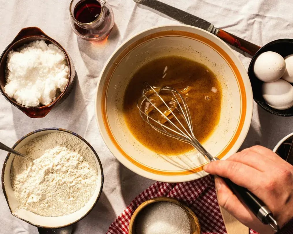 browned butter being mixed in with other ingredients