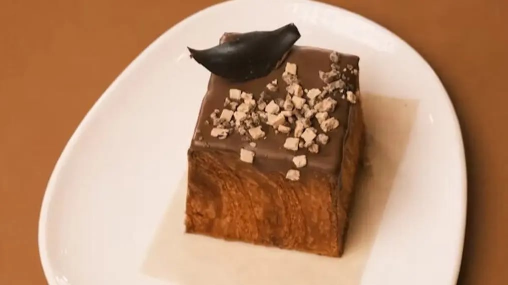 Mocha chocolate frosting with crushed almonds