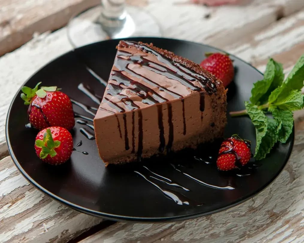 Slice Of Walnut Cheesecake With Bournville