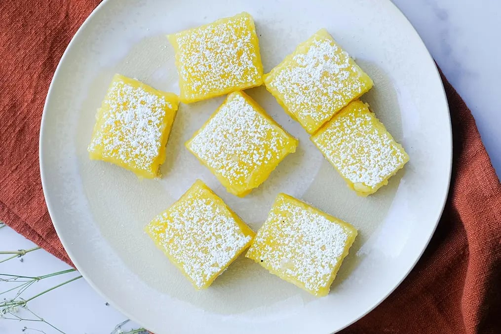 Refreshing vegan lemon bars to satisfy your sweet tooth - Plate of Lemon Bar