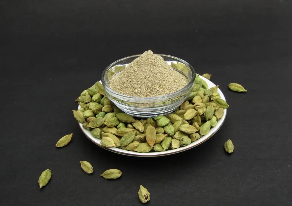 Introduce sugar and cardamom at the time that is appropriate