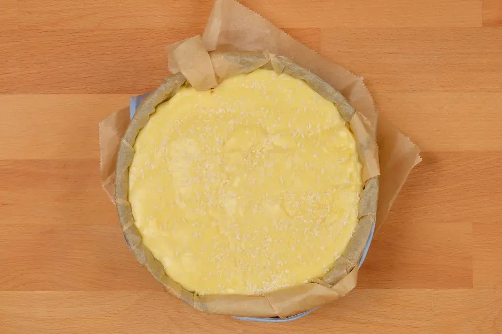 Step-by-Step Guide to Making Coconut Cream Pie with Almond Crunch - Layer the Custard into the Base