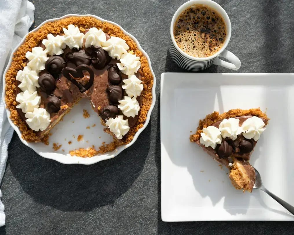 Decorated Wine Infused Chocolate Tart with a Piece Served on Plate
