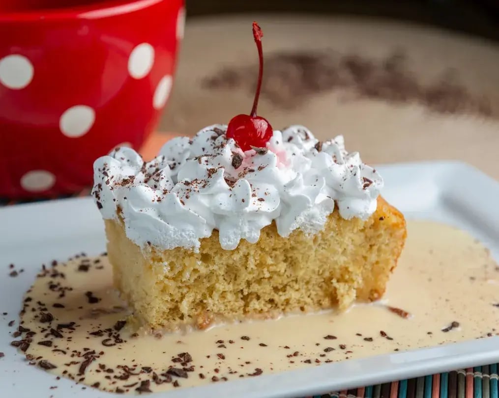 Tres leches cake with whipped cream