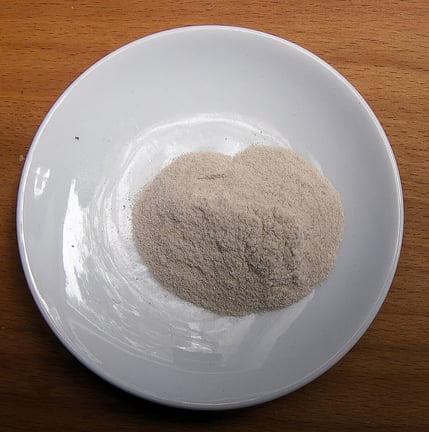 Feature Image - Psyllium Husk Scoops On A White Plate