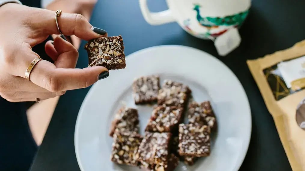 These vegan brownies with nutty toppings are rich, luxurious and will earn you praises - Vegan Brownie Image 1