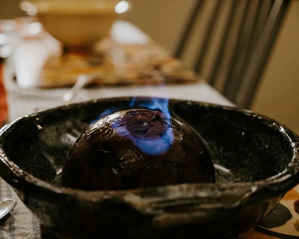 Christmas Pudding served flambe style