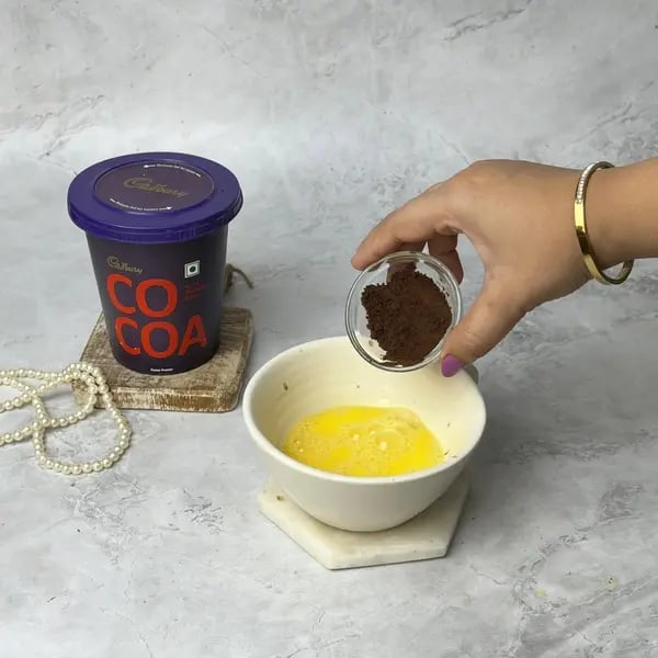 1 Minute Nutty Mug Cake - Adding Cocoa Powder
