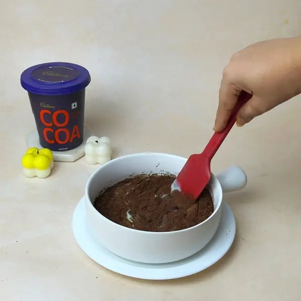 2-Ingredient Cocoa Fudge - Stirring Fudge Mixture