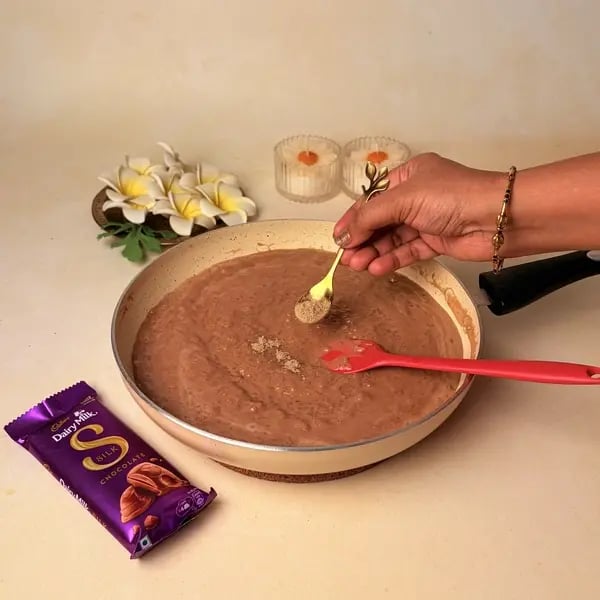 Ada Pradhaman With Cadbury Dairy Milk Silk For Onam - Stirring Spices Into Payasam