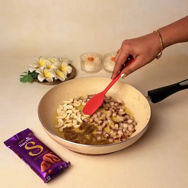 Ada Pradhaman With Cadbury Dairy Milk Silk For Onam - Frying Nuts And Raisins