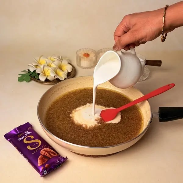 Ada Pradhaman With Cadbury Dairy Milk Silk For Onam - Pouring Coconut Milk