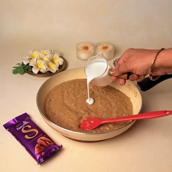 Ada Pradhaman With Cadbury Dairy Milk Silk For Onam - Stirring Coconut Milk