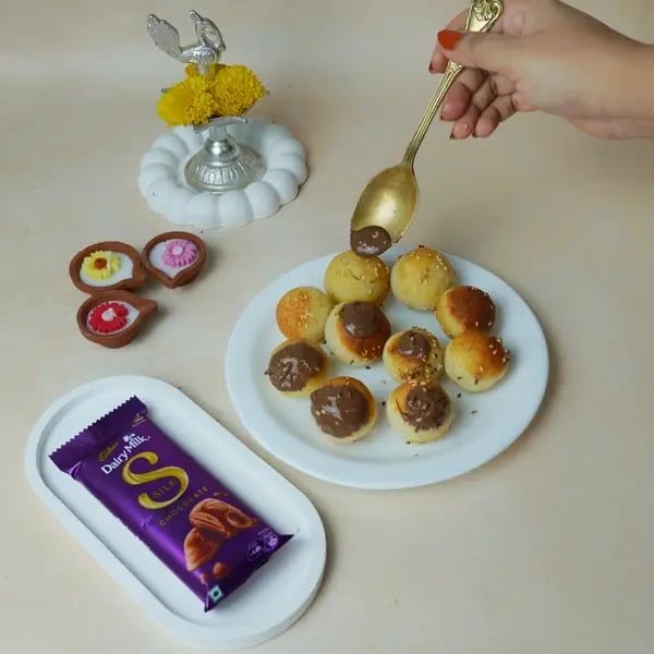 Anarsa Recipe With Dairy Milk Silk: Give This Traditional Diwali Sweet A Gooey Chocolate Center - Garnished Anarsa With Chocolate