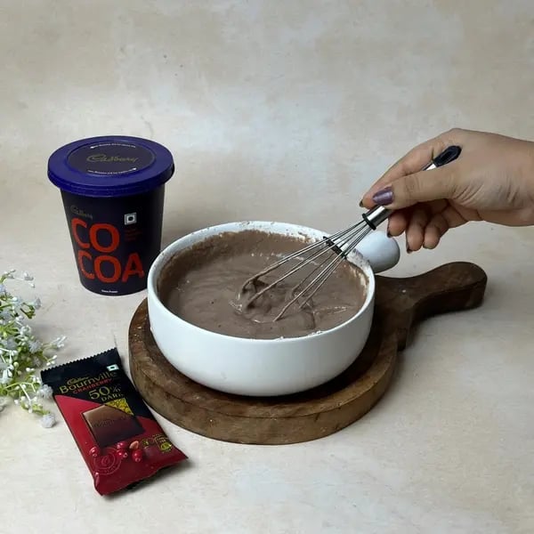 Bakery-Style Double Chocolate Bournville Cocoa Muffins - Folding Batter Gently