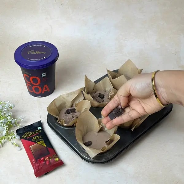 Bakery-Style Double Chocolate Bournville Cocoa Muffins - Sprinkling Chocolate Chips