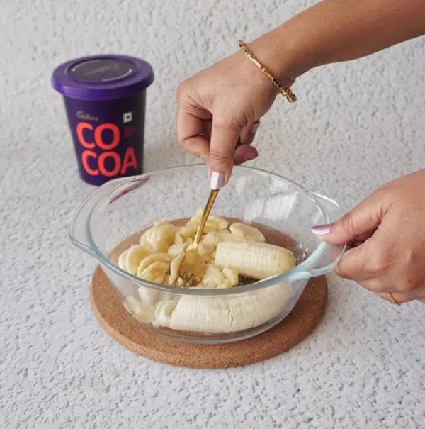 Banana Chocolate Brownies with Cashews - Mash the ripe bananas