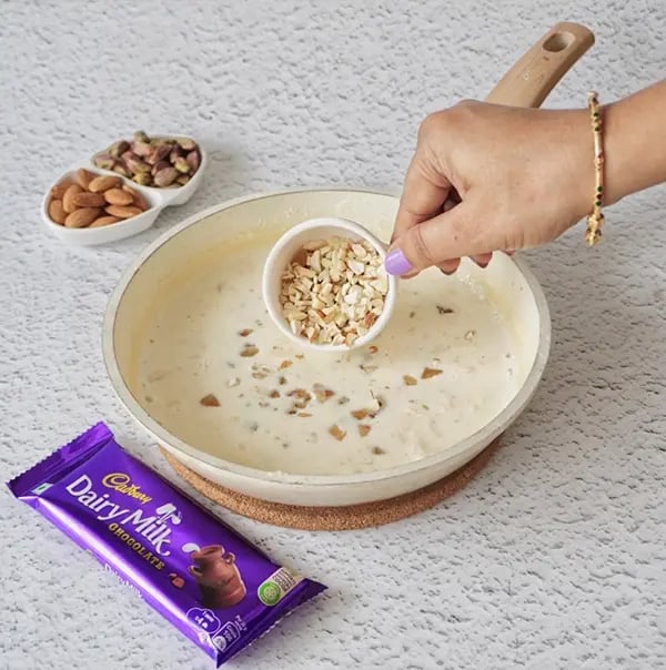 Basundi With Dry Fruits and Cadbury Dairy Milk Chocolate-Add the chopped nuts