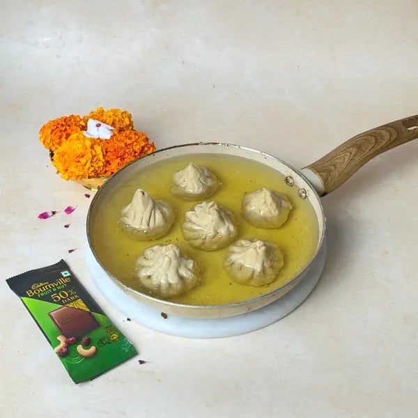 Beyond Ukadiche, Try This Easy Dairy Milk Stuffed Fried Modak Recipe - Frying Modaks In Oil