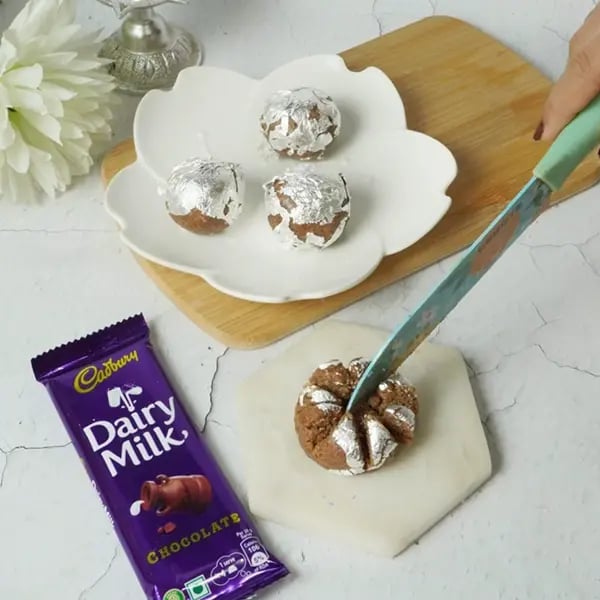 Bhai Dooj Special Dairy Milk Cashew Lotus Sweet-Cover the ball with silver varq